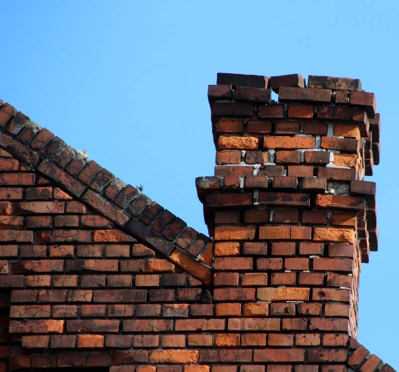 Damaged chimney on an La Salle home showing cracks and missing mortar